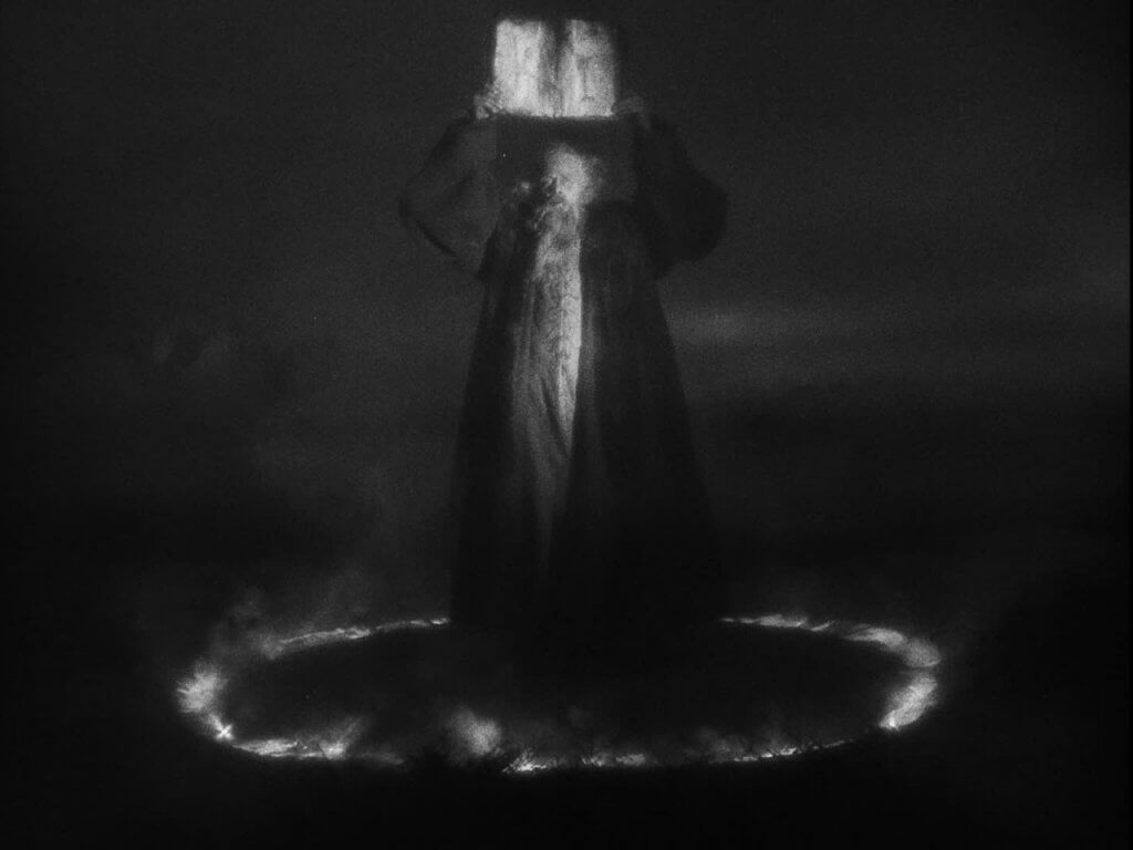 Still from Faust (1926): Faust calling upon the devil.
